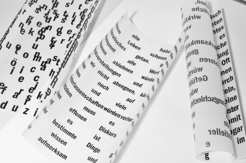 Rolls of paper with several written words.  Natural Language Processing, Frank Berrocal, #FrankBerrocal